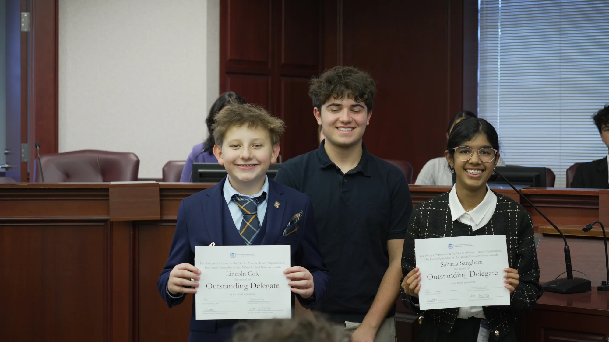 Students receiving awards at JAMUN conference